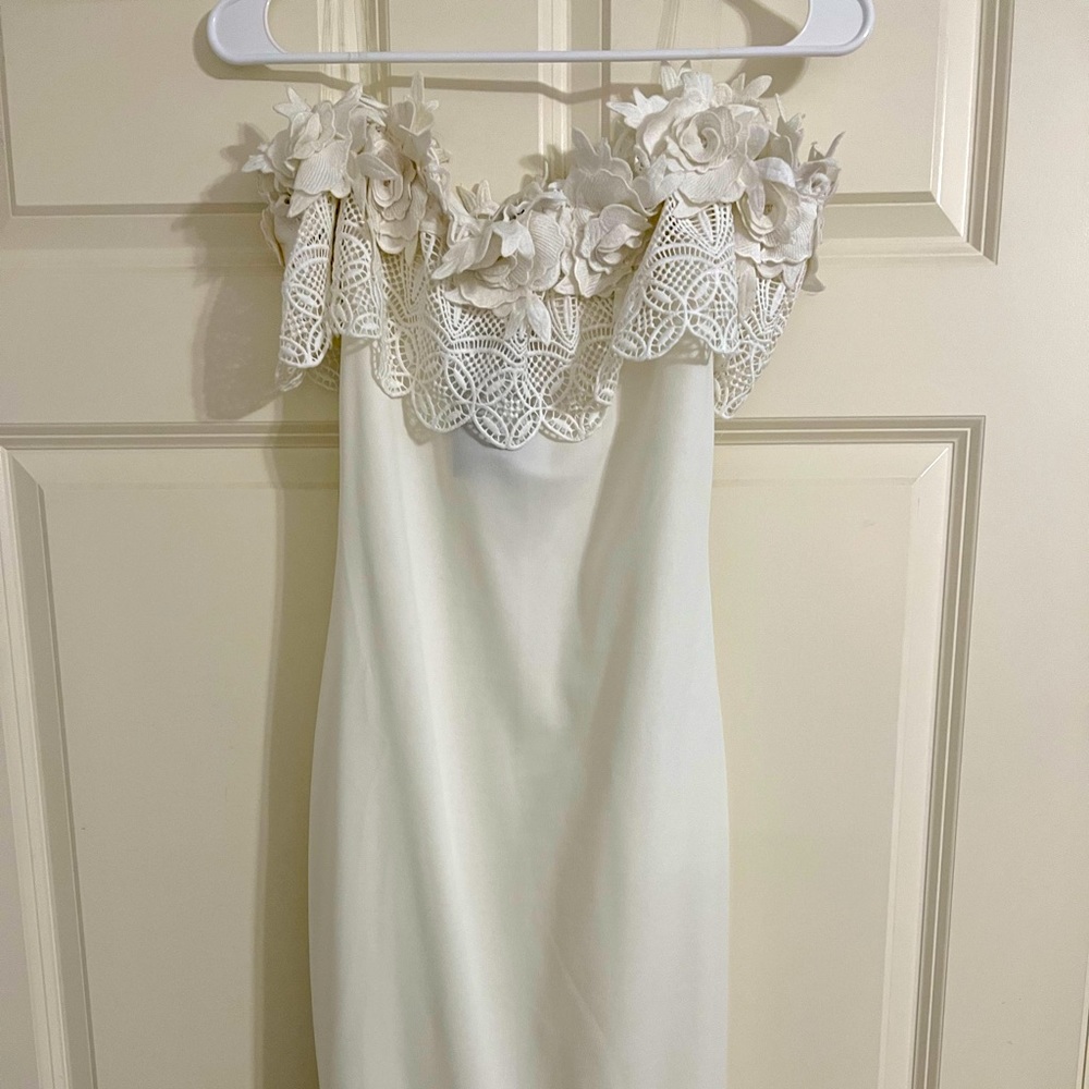 Brand new white strapless dress. Size medium.